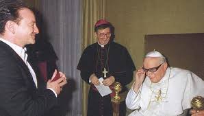 Bono sharing his signature sunglasses with St. John Paul II
